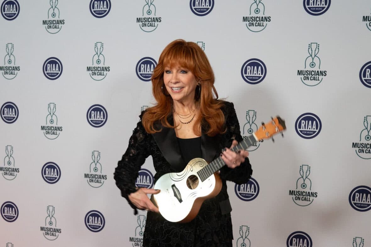 Reba McEntire holds the Music Heals Golden Ukulele Award during the first-ever national celebration for Musicians On Call at The