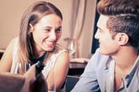 Man and Woman Laughing in Bar