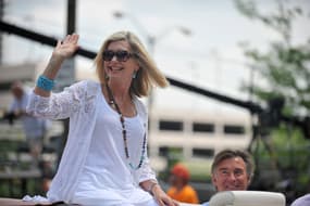 May 26, 2012; Indianapolis, IN, USA; Olivia Newton-John grand marshal for the 2012 IPL 500 Festival Parade waves to fans as she