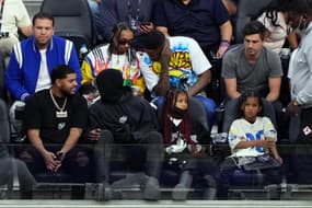 Feb 13, 2022; Inglewood, California, USA; American rappers 2 Chainz, YG, Tyga, Justin Laboy and Kanye West, with his children / north west