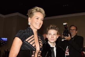 Jan 7, 2018; Beverly Hills, CA, USA; Sharon Stone arrives with her son, Roan Joseph Bronstein, in the International Ballroom for