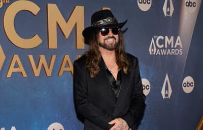 Billy Ray Cyrus arrives on the red carpet for the 59th Annual CMA Awards at Music City Center in Nashville, Tenn., Wednesday,