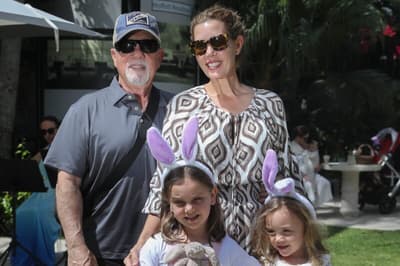 Musician and singer Billy Joel poses for a photo with his family at the Royal Poinciana Plaza during the Royal Easter Affair