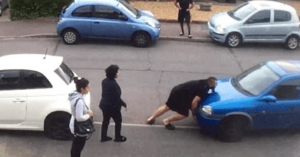 strongman moves car