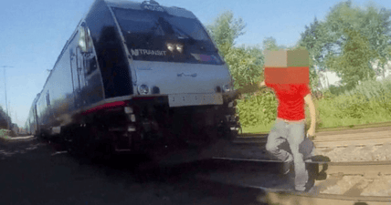 cop saves man sleeping train tracks