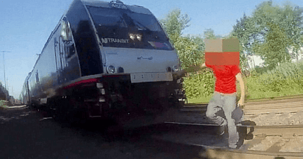 cop saves man sleeping train tracks