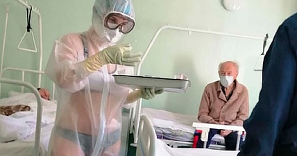 'Hot' Nurse in see-through PPE