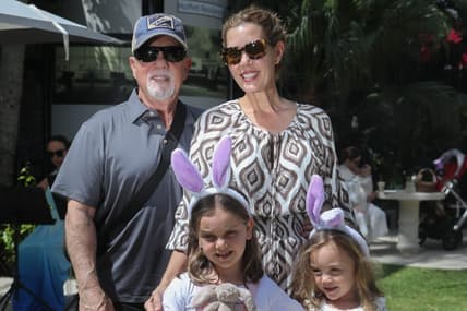 Musician and singer Billy Joel poses for a photo with his family at the Royal Poinciana Plaza during the Royal Easter Affair