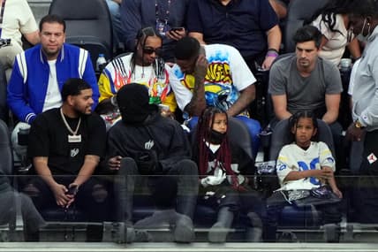 Feb 13, 2022; Inglewood, California, USA; American rappers 2 Chainz, YG, Tyga, Justin Laboy and Kanye West, with his children / north west