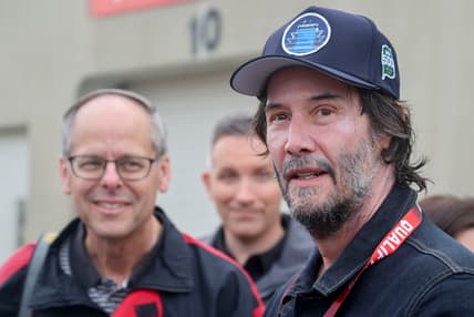 May 25, 2025; Indianapolis, Indiana, USA; Keanu Reeves talks to fans in the garage area Sunday, May 25, 2025, ahead of the 109th