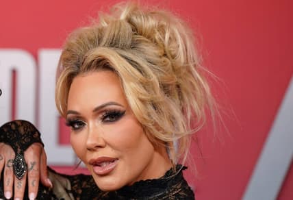 Bunnie Xo Shares Cryptic Jelly Roll and Bunnie XO arrive on the red carpet before the 60th Academy of Country Music Awards at the Ford Center at The Star