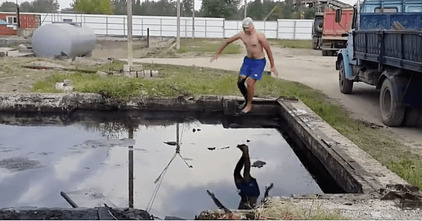 man jumps into motor oil pool