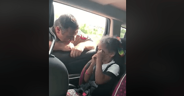 officer comforts little girl