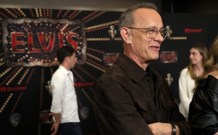 Tom Hanks greets the press during a red carpet event before the screening for the new biopic movie 'Elvis' at Graceland in
