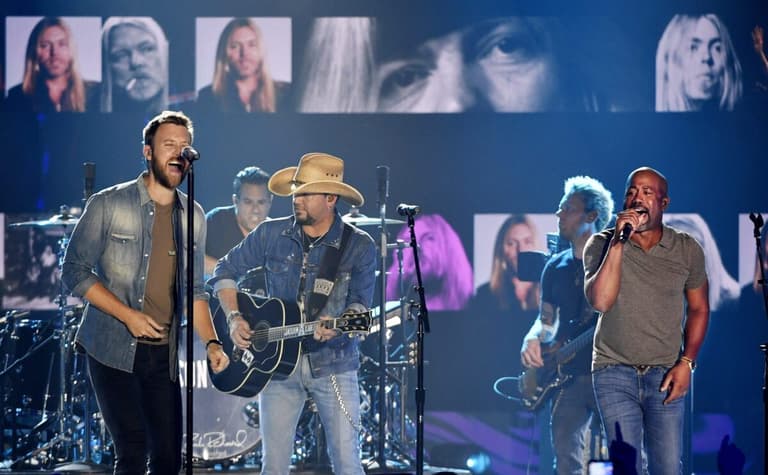 Charles Kelley, left, Jason Aldean and Darius Rucker perform together for a tribute to Gregg Allman during the CMT Music Awards