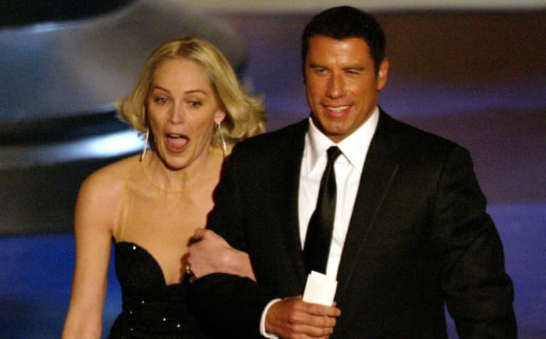 Mar 24, 2002; Los Angeles, CA, USA; Sharon Stone and John Travolta present the best foreign film catagory at the 74th annual