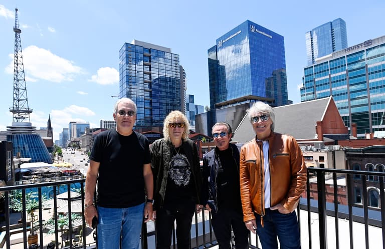 Bon Jovi band members, Hugh McDonald, left, David Bryan, Tico Torres and Jon Bon Jovi, admire the new JBJ’s rooftop bar and