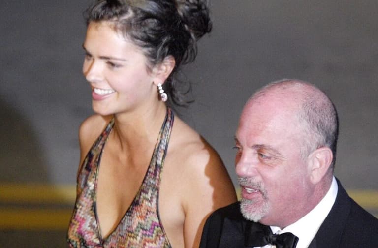 Billy Joel and wife Katie head for limo following Donald Trump's wedding at Bethesda by the Sea in Palm Beach in 2005.