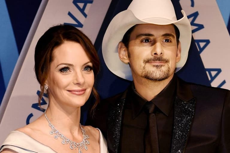 Brad Paisley, right, and wife Kimberly Williams-Paisley pose on the red carpet at the Music City Center before the start of the