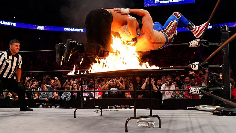 AEW Flaming Table Spot