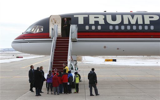 Children gather to tour the plane of Republican presidential candidate Donald Trump at a campaign event at Dubuque Regional Airport, Saturday, Jan. 30, 2016 in Dubuque, Iowa. (AP Photo/Paul Sancya)