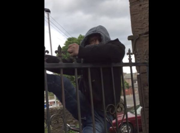 criminal stuck on fence