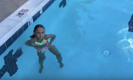 girl swims length of pool