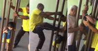 Kid gets head stuck between bars