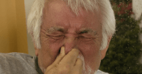 holding in a sneeze