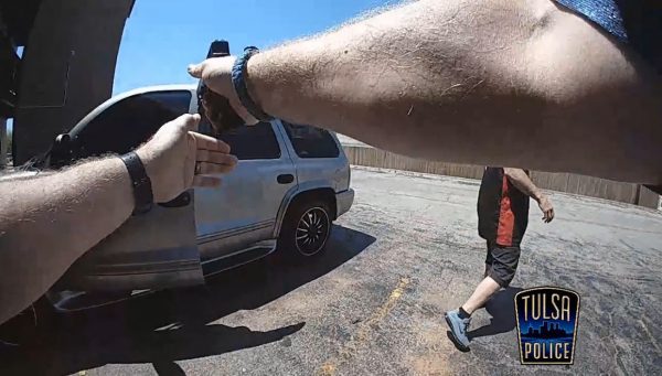 officer shoots criminal holding gun