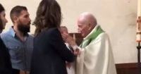 priest slaps baby