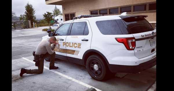 officer kneels prayer shift