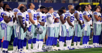 dallas cowboys national anthem standing