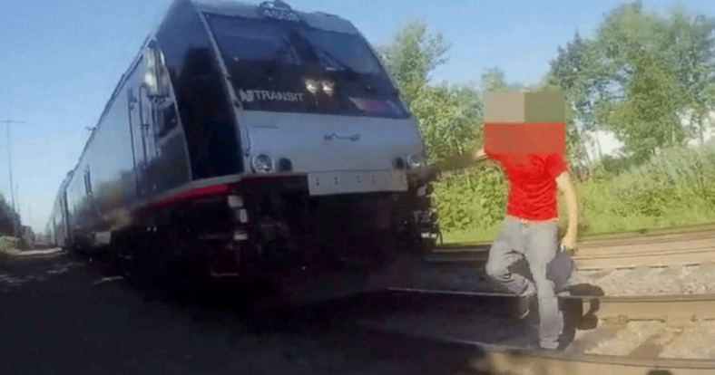 cop saves man sleeping train tracks