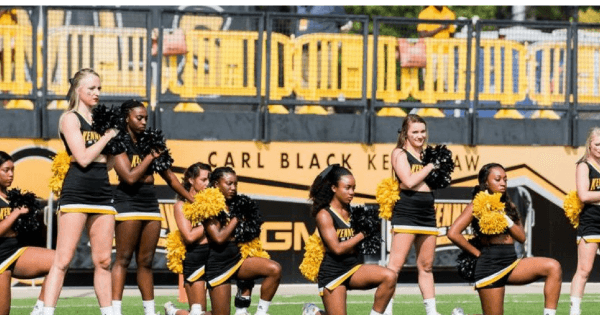 cheerleaders kneeling anthem