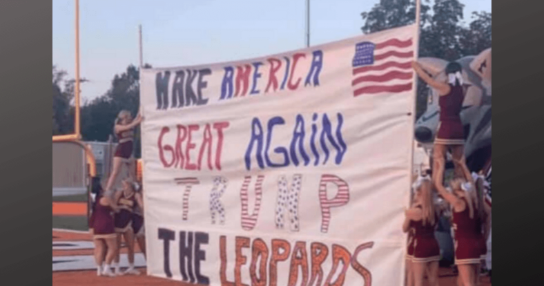 Cheerleaders under fire by PC Police over Trump sign