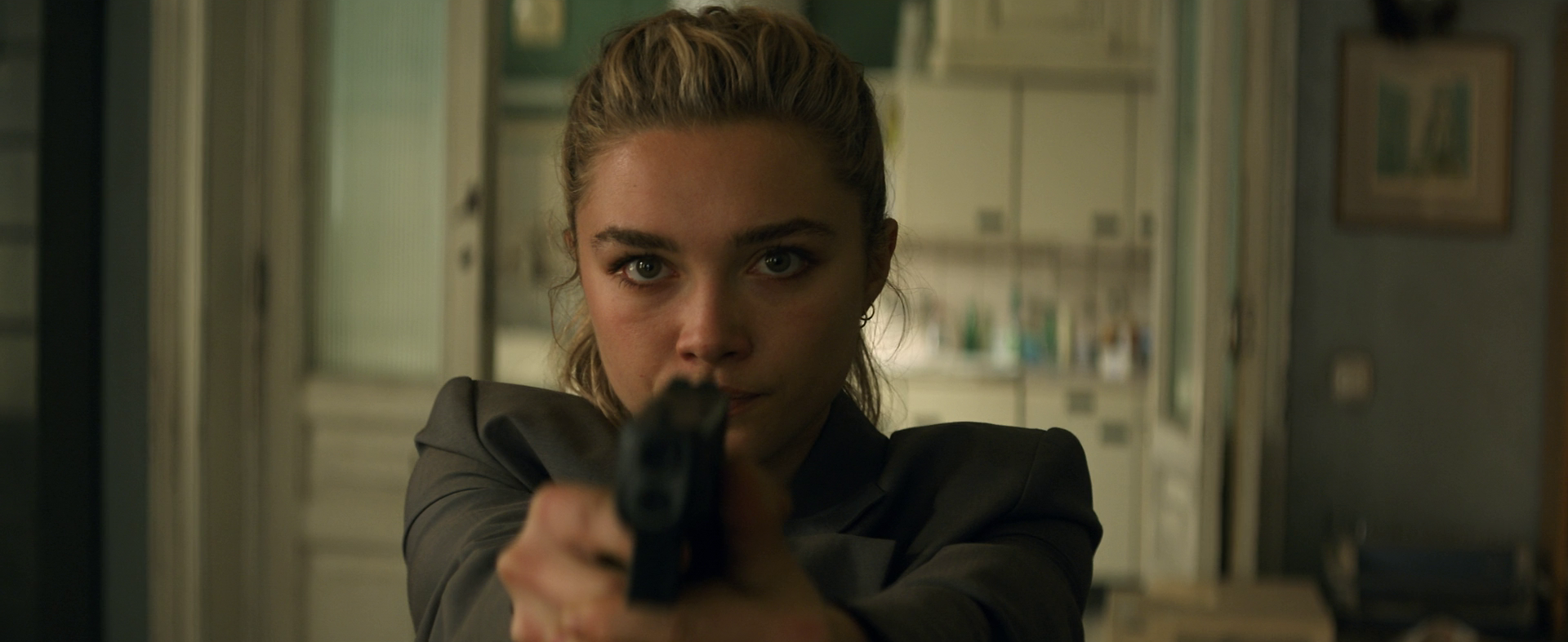 Yelena Belova (Florence Pugh) draws on an intruder in Black Widow (2021), Marvel Entertainment