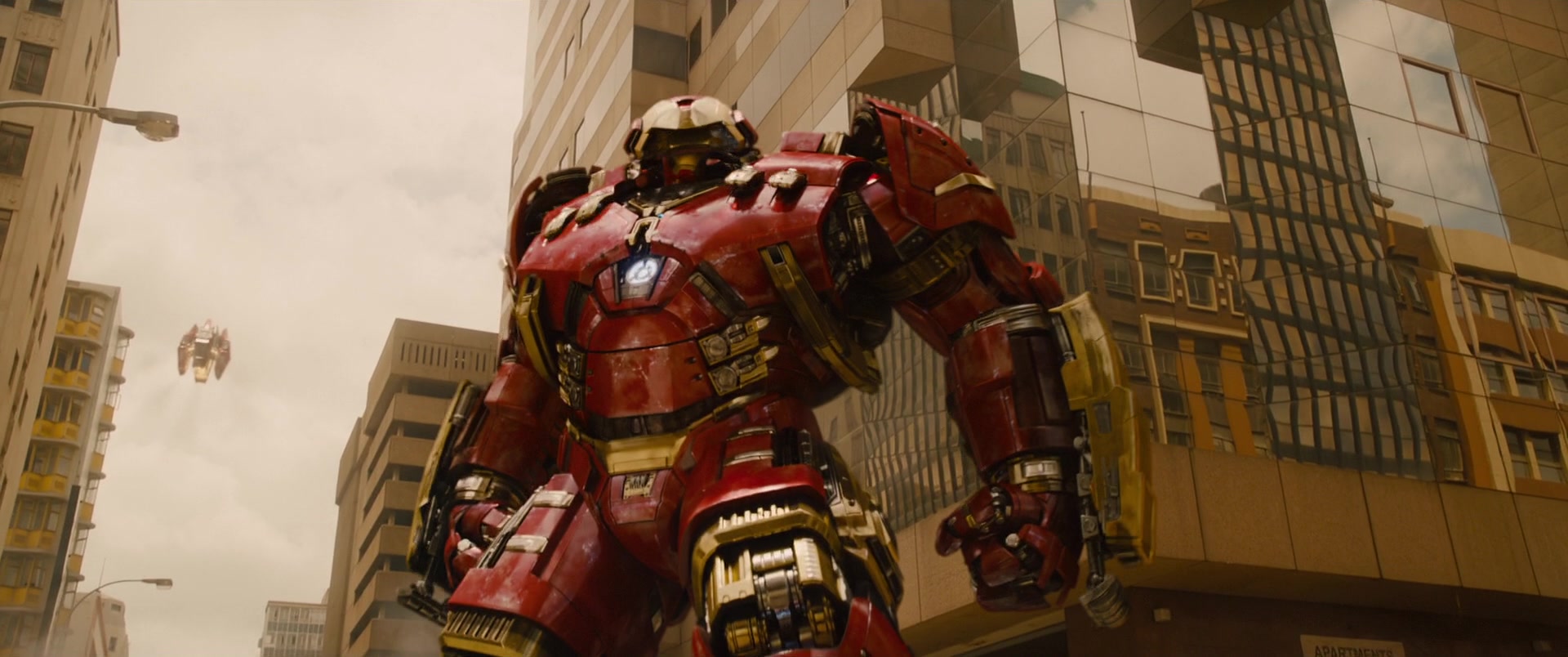 Iron Man (Tony Stark) dons his Hulkbuster armor in Avengers: Age of Ultron (2015), Marvel Entertainment