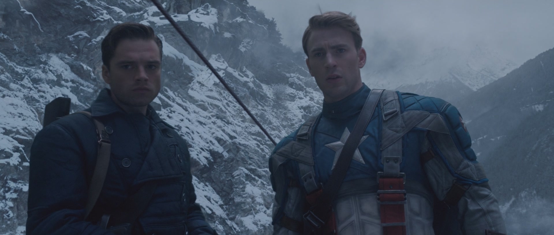 Captain America (Chris Evans) and Bucky (Sebastian Stan) stand atop a HYDRA train in Captain America: The First Avengers (2011), Marvel Entertainment